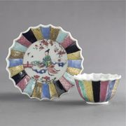 A CHINESE EXPORT FAMILLE-ROSE FLUTED TEABOWL AND SAUCER
CIRCA 1735-40
