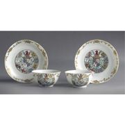 A PAIR OF CHINESE EXPORT ARMORIAL SMALL TEABOWLS AND SAUCERS
CIRCA 1745-50

