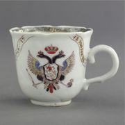 CHINESE EXPORT ARMORIAL PETAL-MOLDED COFFEE CUP
DATED 1742
