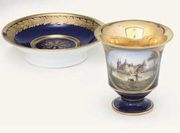MEISSEN BLUE-GROUND TOPOGRAPHICAL CABINET-CUP AND SAUCER 
