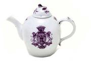 A VOLKSTEDT BULLET-SHAPED ARMORIAL TEAPOT AND A COVER